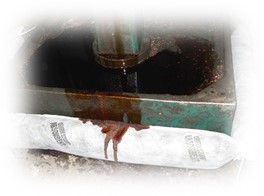 Absorbent sock adsorbing oil leak